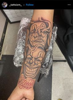 a person with a tattoo on their arm has a clown mask tattooed on his leg