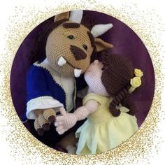 a crocheted doll and stuffed animal are posed together