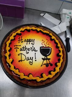 a birthday cake with the words happy father's day written on it and an image of a bbq grill