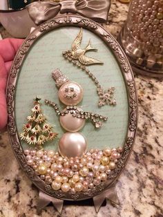 a close up of a clock with pearls and bows on it