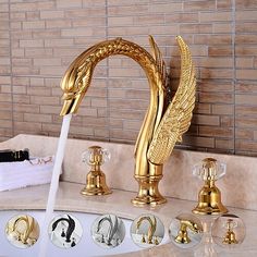 a golden faucet with water running from it's spout in a bathroom