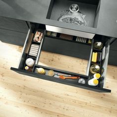 an overhead view of a kitchen sink and counter top with utensils in it