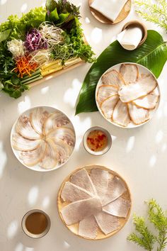 an overhead view of food on plates and bowls