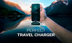 a person holding up a cell phone in front of a mountain lake with the words perfect travel charger