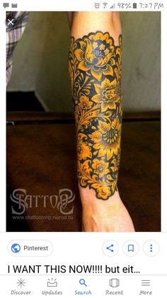 a person with a yellow and black tattoo on their leg is standing in front of the camera