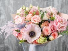 a bouquet of pink and white flowers in a vase