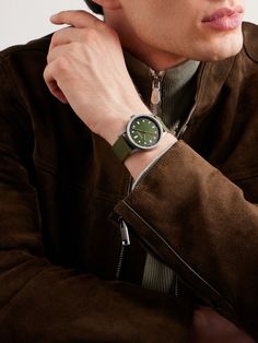 "A watch is one of the only accessories a man can wear and show some individuality, " says George Bamford. Inspired by classic racing cars, Bamford Watch Department's 'B80 Adventure' model is powered by a Swiss-made Sellita SW300-1 automatic movement with a 56-hour power reserve and has bold Art-Deco indices and hands. The dial is designed to match the colour of its relaxed canvas strap. For warranty information, please refer to details & care Bamford Watch, Smart Watches For Men, Laurent Ferrier, Classic Racing Cars, Latest Watches, Automatic Watches For Men, Bold Art, Rubber Watches, Chronograph Watch Men