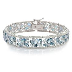 This beautiful bracelet features a wider setting with blue topaz and london blue topaz gemstones in a cluster like pattern to give off more shine. The sterling silver bracelet secures with a safety catch and pressure clasp. Product Details Metal Type sterling-silver Metal Stamp 925-sterling Weight 22.25GR Length 7.25IN Width 12.3MM Height 3MM Clasp Type box-with-tongue Stone Details Gem Type london-blue-topaz Number of Stones 32 Stone Color blue Stone Shape round-shape Total Weight 2.64 Setting Iced Gems, Oval Jewelry, Cluster Bracelet, Cluster Bracelets, Bow Bracelet, Hot Jewelry, Amethyst Cluster, Pretty Bracelets, Fine Jewelry Bracelets