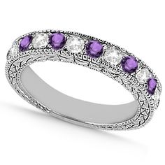 an antique style wedding band with purple and white stones