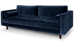 a blue velvet couch with wooden legs on an isolated white background for use in interior design