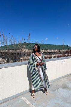 Rich Auntie at it's finest! Our fashion satin kimono can be worn as an oversized dress on it's own or cinched at the waist for a more fitted look. Flowy and colorful style definitely can make this a beach coverup or vacation look. In One Size fits up to size 3X. as the sleeves are open flowy and the kimonos have an open front. Styling tip: Pairs perfectly with our Summertime Maxis, T Shirt Maxis and strapless smocked rompers. Size US Size One Size Chic Spring Robe For Brunch, Green Spring Vacation Robe, Spring Vacation Green Robe, Fall Vacation Robe With Kimono Sleeves, Oversized Spring Kaftan For Day Out, Oversized Kaftan For Spring Day Out, Oversized Kaftan For Day Out In Spring, Oversized Green Kimono For Spring, Green Oversized Kimono For Spring