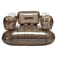 an inflatable chair with three pillows on it