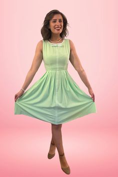 Samantha will add some cheer and positive energy to your wardrobe. Reminiscent of the 1960's color palettes of soft light green with white trim detail on the bow and center front makes this darling dress perfect for casual everyday wear. Features pleated circle skirt with hidden side seam pockets. Don't forget to add a crinoline underneath for that true-to-vintage look! PRODUCT DETAILS: Scoop neckline with bow detail Sleeveless Pleated circle dress Pockets Fabric has no stretch Easy to wear Back Retro Spring Dresses With Bow, Pleated Circle Skirt, Dress Pockets, Circle Dress, Darling Dress, 60s Dress, Inspired Dress, White Trim, Circle Skirt