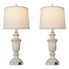 two white table lamps sitting next to each other