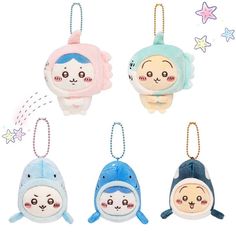 four small stuffed animals hanging from strings