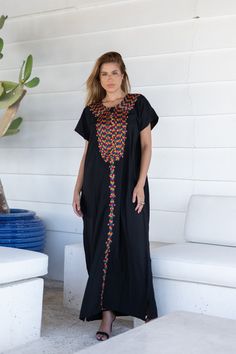 A bohemian flash caftan made of light mesh of linen and poly, the fabric is unique in that it's very flowy and not the usual feel and touch of linen. This Kaftan is ideal to wear for any casual occasion. Whether taking a trip down the shopping lane, or home-based kitty parties, or about anything else, wearing this dress will make you feel classy and comfortable. Fabric : 50% Linen, 50% Polyester. Please note that the fabric on this Kaftan has some weight to it and is meant to give off that crumb Black Abaya With Floral Embroidery, Black Kaftan For Eid, Traditional Black Free Size Kaftan, Black Free-size Tunic Dress, Black Free Size Tunic Dress, Bohemian Black Kaftan For Eid, Black Bohemian Kaftan For Eid, Traditional Long Black Kaftan, Black Kaftan For Beach