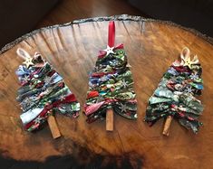 three small christmas trees made out of fabric