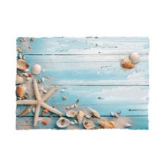 seashells and starfish on blue painted wood