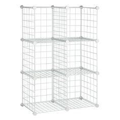 four white wire baskets stacked on top of each other