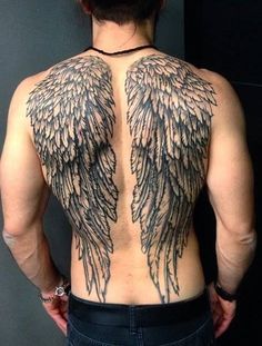 the back of a man's upper body with wings on his back and chest