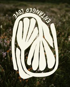 a close up of a flower field with the words enliwed tone on it