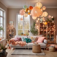 a living room filled with furniture and lots of lights hanging from the ceiling above it