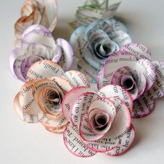 several rolled up flowers sitting on top of each other