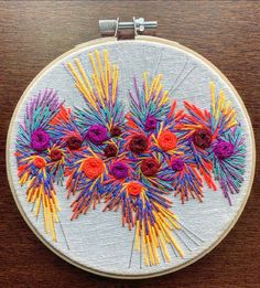 an embroidery project with colorful flowers on it