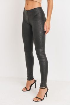 Every fashionista knows she must have a pair of faux snake skin leather leggings in her fall fashion wardrobe. Featuring a high fashion faux leather fabric and body sculpting fit. Make these pants this seasons go-to when dressing them up with your favorite pieces from home! Lightweight Fitted Elastic Waist Fitted Pleather Comfortable Elastic Waist Low Waist Soft Stretchy Material Regular Waist Snake Skin Leggings Embossed Snake Skin PU Leather Leggings 96% Polyester 4% Spandex XOB-PCC-5 Chic Metallic Leather Pants For Fall, Trendy Metallic Leggings For Fall, Chic Fitted Metallic Leather Pants, Metallic Leggings For Night Out In Fall, Snake Skin Pants, Skin Leggings, Cute Slides, Legging Fits, Faux Leather Fabric