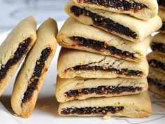 a stack of cookies sitting on top of a white plate