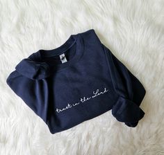 This listing is for a navy blue sweatshirt with Trust in the lord design embroidered on it. This is NOT a heat press design. This is machine embroidered with thread. Navy Long Sleeve Sweatshirt With Embroidered Logo, Blue Long Sleeve T-shirt With Embroidered Text, Blue Embroidered Fleece Sweatshirt, Navy Cotton Sweatshirt With Embroidered Logo, Navy Cotton Sweater With Embroidered Logo, Navy Long Sleeve Sweater With Embroidered Logo, Blue Sweater With Embroidered Text For Fall, Blue Embroidered Text Sweater For Fall, Heat Press Designs