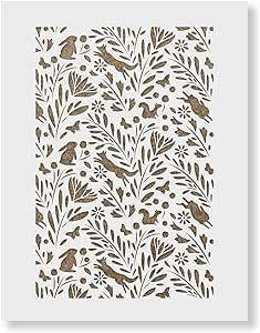 an intricate paper cutting pattern with birds and flowers on it, in brown ink against a white background