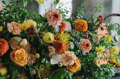 a bunch of flowers that are sitting on a table