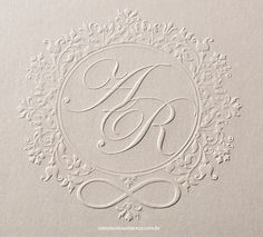 an ornate monogrammed design on the inside of a wedding album