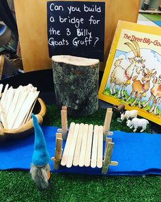 an assortment of wooden toys and books on display at a children's book fair