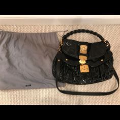 Black Patent Leather Miu Miu Coffer Bag With Gold-Tone Hardware, Removable Long Strap, Braided Top Handle, Push Lock Closure At Front Flap. Includes Dust Bag. Retails $1500. ***Disclaimer: Very Discounted Price Due To Flaking Of Patent Leather. It Is Difficult To Keep Patent Leather For Many Years Without This Happening. It's Such A Great Bag In Perfect Condition Otherwise. I'm Sure It Can Be Fixed But You Can Visibly See Peeing Around Edges*** Miu Miu Satchel Shoulder Bag For Evening, Black Top Handle Miu Miu Shoulder Bag, Miu Miu Shoulder Bag For Evening, Black Miu Miu Top Handle Shoulder Bag, Black Miu Miu Shoulder Bag With Top Handle, Miu Miu Black Shoulder Bag For Everyday Use, Designer Miu Miu Shoulder Bag For Evening, Luxury Black Miu Miu Shoulder Bag, Designer Miu Miu Shoulder Bag With Gold-tone Hardware