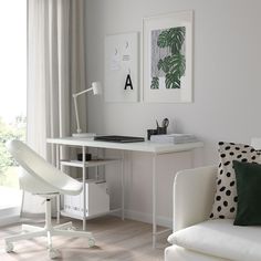 a white desk and chair in a room