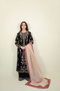 This beautiful three piece is designed on pure black velvet heavily embellished with pretty threadwork details. The length of the long kameez is 48 inches. Styled with a contrasting dupatta and flappers. An alluring three piece for your festive events. Order Duration: 4 to 6 weeks Long Kameez, Pearl Crafts, Pure Black, Embroidered Details, Bridal Designs, Wedding Wear, Raw Silk, Three Piece, Wedding Season