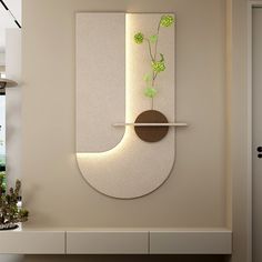 a wall mounted planter on the side of a white wall next to a fireplace