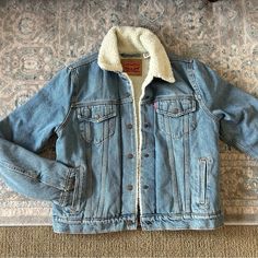 Levi’s Sherpa Trucker Jacker! Size Medium, New Without Tags And Never Worn! Medium/Light Wash Casual Blue Sherpa Outerwear, Levi's White Winter Outerwear, Casual White Sherpa Outerwear, Sherpa Trucker Jacket, Levis Jacket, Trucker Jacket, Jean Jackets, Jean Coat, Jean Jacket