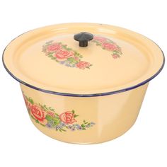 a yellow casserole with roses painted on it