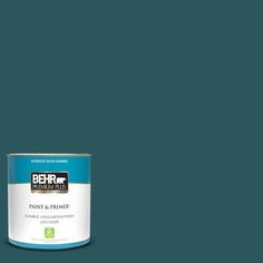 the behr paint and primer is shown in an open, beige - colored tin