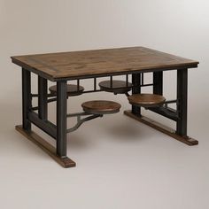 a wooden table with two stools underneath it