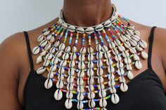 AVANA African Beaded Cowrie Necklace, Gift for her

An authentic cowrie shell necklace that can be worn with any outfit.
100% handmade

Closure: hook

Neck width: 18 inches

3-5 days delivery via DHL Express

The shipping fee is for the first item only and additional items ship for free. Cowrie Shell Art, Traditional Handmade Beaded Necklaces For Summer, Bohemian Cowrie Shell Beaded Necklaces, Bohemian Cowrie Shell Beaded Necklace, Bohemian Cowrie Shell Beaded Necklace For Festival, Handmade Shell-shaped Beaded Necklace For Festival, Traditional Cowrie Shell Beaded Necklaces For Beach, Handmade Cowrie Shell Beaded Necklaces For Festivals, Handmade Cowrie Shell Beaded Necklaces