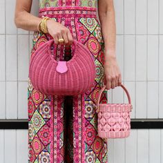 Add a pop of color to your summer accessories collection with this fun and fabulous bag! This chic wicker bucket bag features a leather handle and removable crossbody strap. Product Overview: Materials: wicker, cotton, lambskin, gold hardware Size: 6’’ H (4’’ handle drop) x 5.5’’ W Summer Woven Leather Bag With Round Handle, Summer Straw Bag With Woven Leather And Round Handle, Chic Summer Bags With Bamboo Handle, Chic Woven Leather Straw Bag With Top Handle, Chic Summer Shoulder Bag With Round Handle, Trendy Straw Bag With Round Handle For Spring, Chic Woven Leather Basket Straw Bag, Chic Bucket-shape Shoulder Bag With Bamboo Handle, Chic Bucket Shoulder Bag With Bamboo Handle