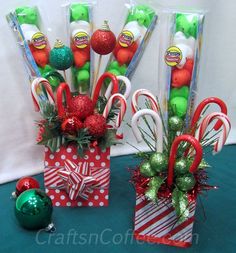 candy canes and candies in small christmas gift bags on a green tablecloth