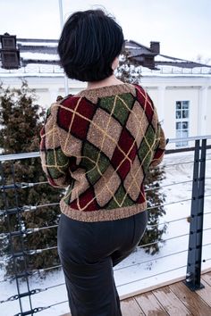 a woman standing on top of a wooden deck