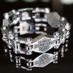 Show Off Your Love With This Stunning Men's Heavy Stainless Bar Shield Motorcycle Chain Bracelet. Crafted With High-Quality Material, This Bracelet Features The Iconic Logo, Making It A Must-Have For Any True Fan. It's Perfect For Adding A Touch Of Style To Any Outfit And Is Sure To Become Your Favorite Accessory. This Bracelet Is Ideal For Collectors And Riders Who Want To Display Their Love For The American Motorcycle Manufacturer. The Bracelet Is Made Of High-Quality Material And Is Suitable Biker Necklace Men, Silver Chain Bracelet For Streetwear, Silver Metal Bracelets For Streetwear, Silver Bracelet With Custom Hardware, Modern Silver Durable Jewelry, Silver Biker Jewelry For Streetwear, Durable Silver Stainless Steel Jewelry, Classic Durable Silver Jewelry, Silver Metal Bracelet With Custom Hardware