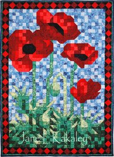 a quilted wall hanging with red flowers and blue sky in the background that says jane j radleyy