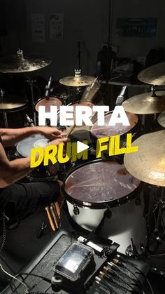 a man sitting in front of a drum set with the words hereta druid fill on it